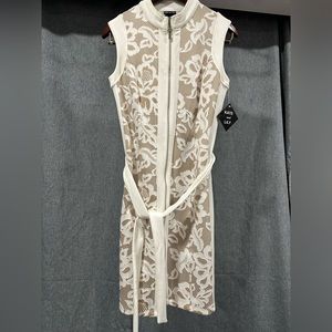 Woman’s dress - white lace over beige - with cloth belt - very scratchy material